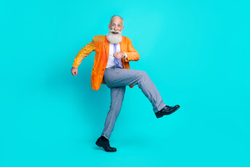 Fototapeta na wymiar Full size profile photo of cheerful granddad walk have good mood isolated on cyan color background