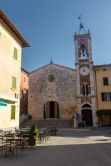 Fototapeta na wymiar San Quirico d'Orcia, Italy, 16 April 2022: Medieval church of the historic center