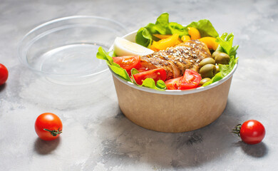 Buddha bowl salad with grilled chicken breast slices, cherry tomatoes, eggs, avocado, lettuce and seeds