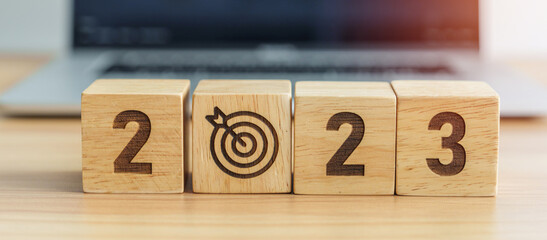 2023 Year block with dartboard icon against computer laptop background. Goal, Target, Resolution,...