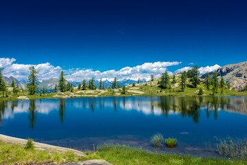 Fototapeta na wymiar Reflection on the Mount Avic Lake in Aosta Valley, Italy