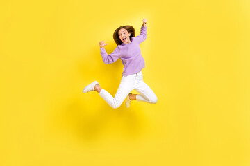 Fototapeta na wymiar Full length photo of carefree funky lady wear stylish violet jumper rejoice win competition champion isolated on yellow color background