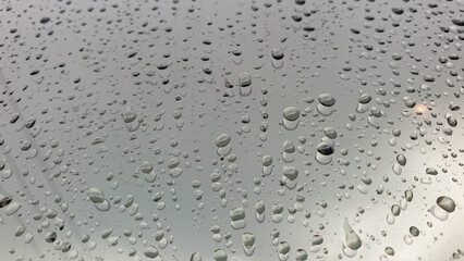 beautiful raindrops on silver glass for background