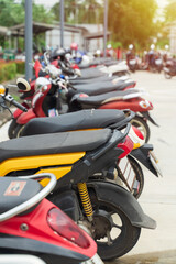 Motorbikes parked on the street, Parking area.	