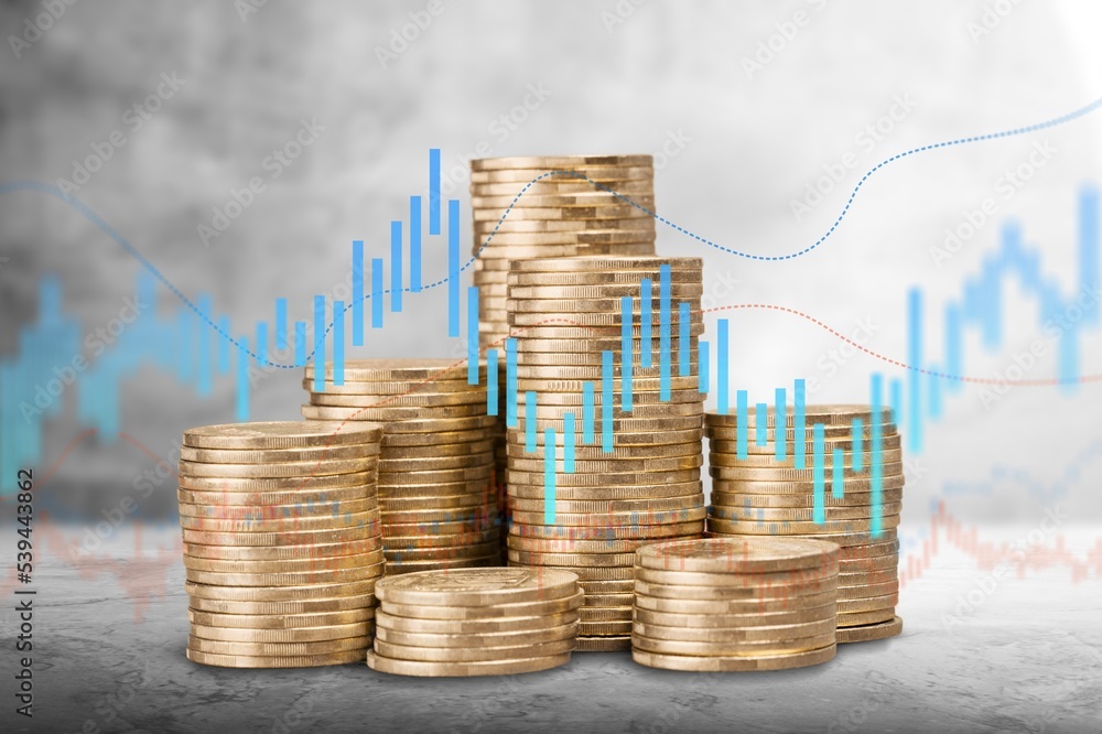 Poster stack of coins with graph or chart on the desk