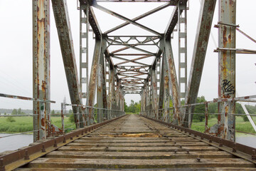 Fototapeta na wymiar Old steel railroad bridge in Latvia