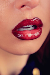 Obraz premium woman with glossy red lipstick close up 
