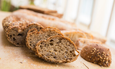 fresh loaf of bread on wooden board