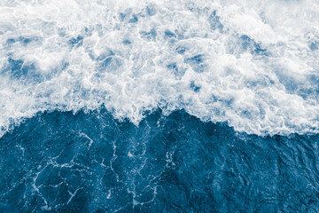 Fototapeta na wymiar Dark blue sea ocean large, big wave and liquid white foam