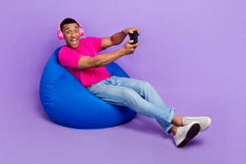 Photo of positive astonished man stylish outfit sit comfort chair have fun enjoy free time empty...