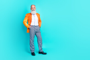 Full length photo of attractive man trendy outfit ready celebrate corporate hand pocket empty space isolated on cyan color background