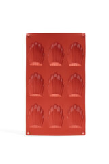 Close-up shot of a red silicone mold for cookies. Empty silicone baking mat is isolated on a white background. Front view.