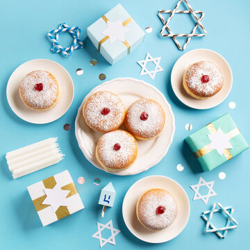 Jewish Holiday Hanukkah Card. Hanukkah Doughnuts Sufganiyot on Blue background.