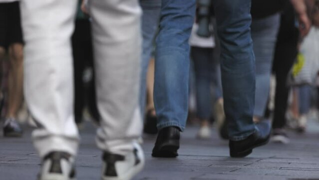 anonymous unrecognizable people, feet of people on the street