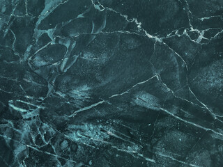 Texture of dark emerald cracked marble with lines pattern, macro background. Navy blue stone...