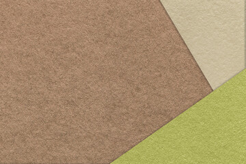 Texture of craft brown color paper background with beige and green border. Vintage abstract umber cardboard.