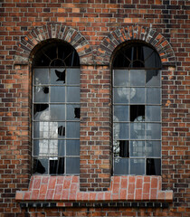 old building, red brick, rounded windows, character of the building. A close-up of the exterior wall of the building. Interesting architecture