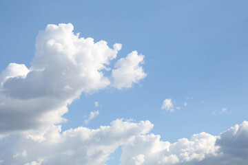 The background of the blue sky with white and gray cumulus clouds. Copy space.