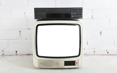 Old white vintage TV with white screen to add new images to the screen, VCR on the background of a brick wall from the 1980s, 1990s, 2000s.