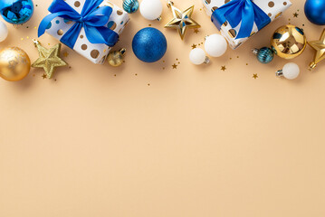 New Year celebration concept. Top view photo of star ornaments white blue gold baubles gift boxes with ribbon bows and confetti on isolated beige background with copyspace