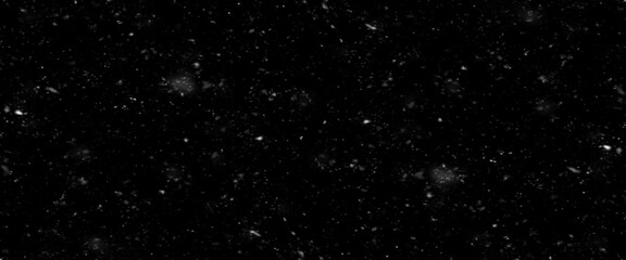 Falling snow isolated on black background. Falling snow at night. Bokeh lights on black background, flying snowflakes in the air. Winter weather. Overlay texture.