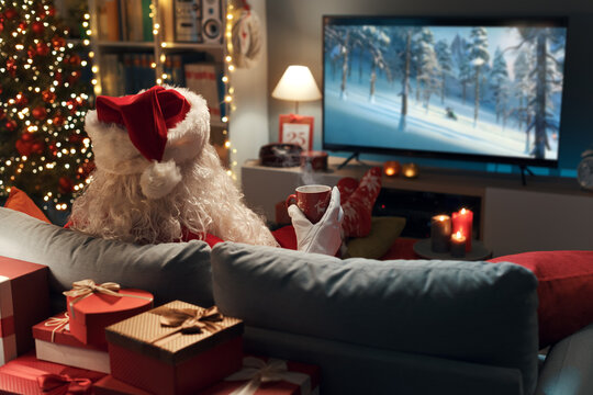 Santa Claus watching movies on TV