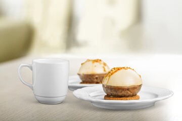Tasty sweet dessert and a cup of drink on table