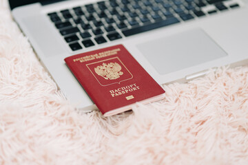 Russian Federation foreign passport on laptop keyboard. Prohibition of access to the Internet...