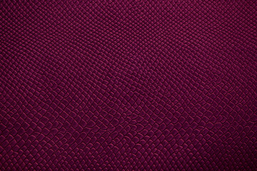 Beautiful bright eco-leather, animal skin texture in purple color, close-up as a background.