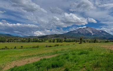 Fototapeta na wymiar green valley along Colorado State Highway 133 near Carbondale with Mt. Sopris scenic view