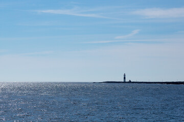 Lighthouse next to ocean