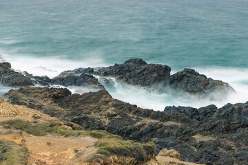 waves crashing on rocks