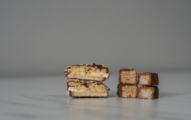 Chocolate bars cut in half on the white background