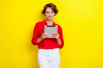 Photo of gorgeous positive person arms hold tablet write email isolated on yellow color background