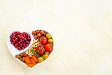 Diet cooking concept with healthy food in heart shaped plate
