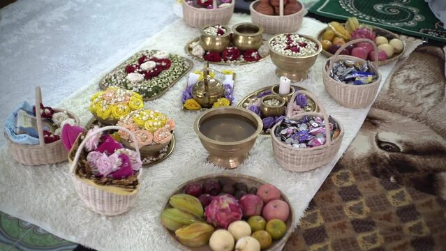 Javanese siraman cultural ceremony accessories and details come with rose petal, coconut, and water vessel, applicable for wedding and pregnancy celebration