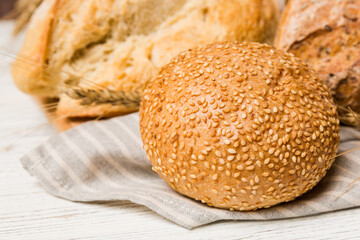 Homemade natural breads. Different kinds of fresh bread as background, perspective view with copy space