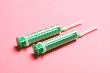 Top view of medical syringes on colorful background. Health care concept with copy space