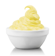 Close-up of fresh yellow cream in white bowl isolated on white background