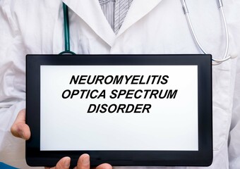 Neuromyelitis Optica Spectrum Disorder.  Doctor with rare or orphan disease text on tablet screen...