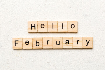 hello February word written on wood block. hello February text on table, concept