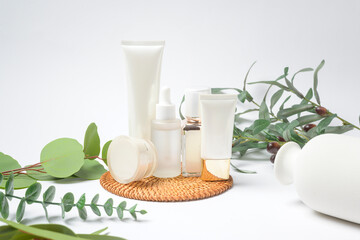 moisturizing cream bottle over leaf background studio, packing and skincare beauty concept.