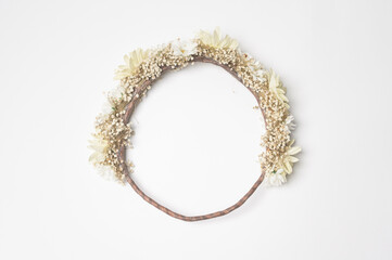 Flowers head crown over white background.