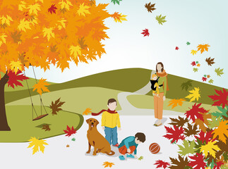Une mère et ses trois enfants jouant dans un parc en automne avec des montagnes en fond.