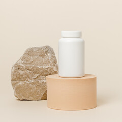 White bottle for pill or vitamins on podium with stone at the background, eco supplement, natural...