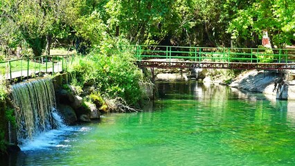 Dam and fish farm near Tropic restaurants on the river. Places on the river with tourists in forest, Turkey