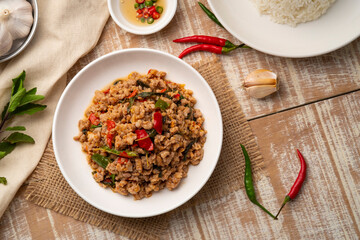Stir Fried Minced Pork with Basil leave on white plate.Top view