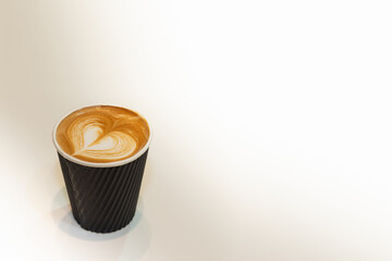 A cup of coffee on white marble table. Coffee on white background