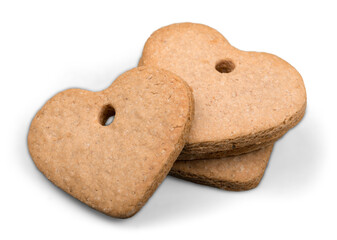 Heart shaped cinnamon cookies on background