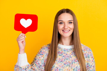 Like button of social media. Smiling woman hold heart icon recommend follow share blog studio shot isolated on bright background.